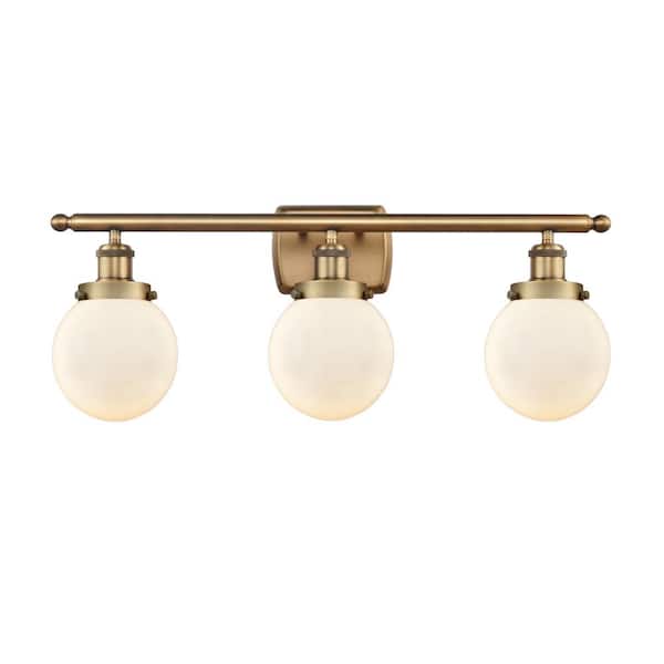 Beacon 26 in. 3-Light Brushed Brass, Matte White Vanity Light with White Glass Shade