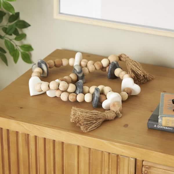 Litton Lane Light Brown Handmade Marble Beaded Heart Garland with Tassel with Knotted Brown Jute and Black and White Accents