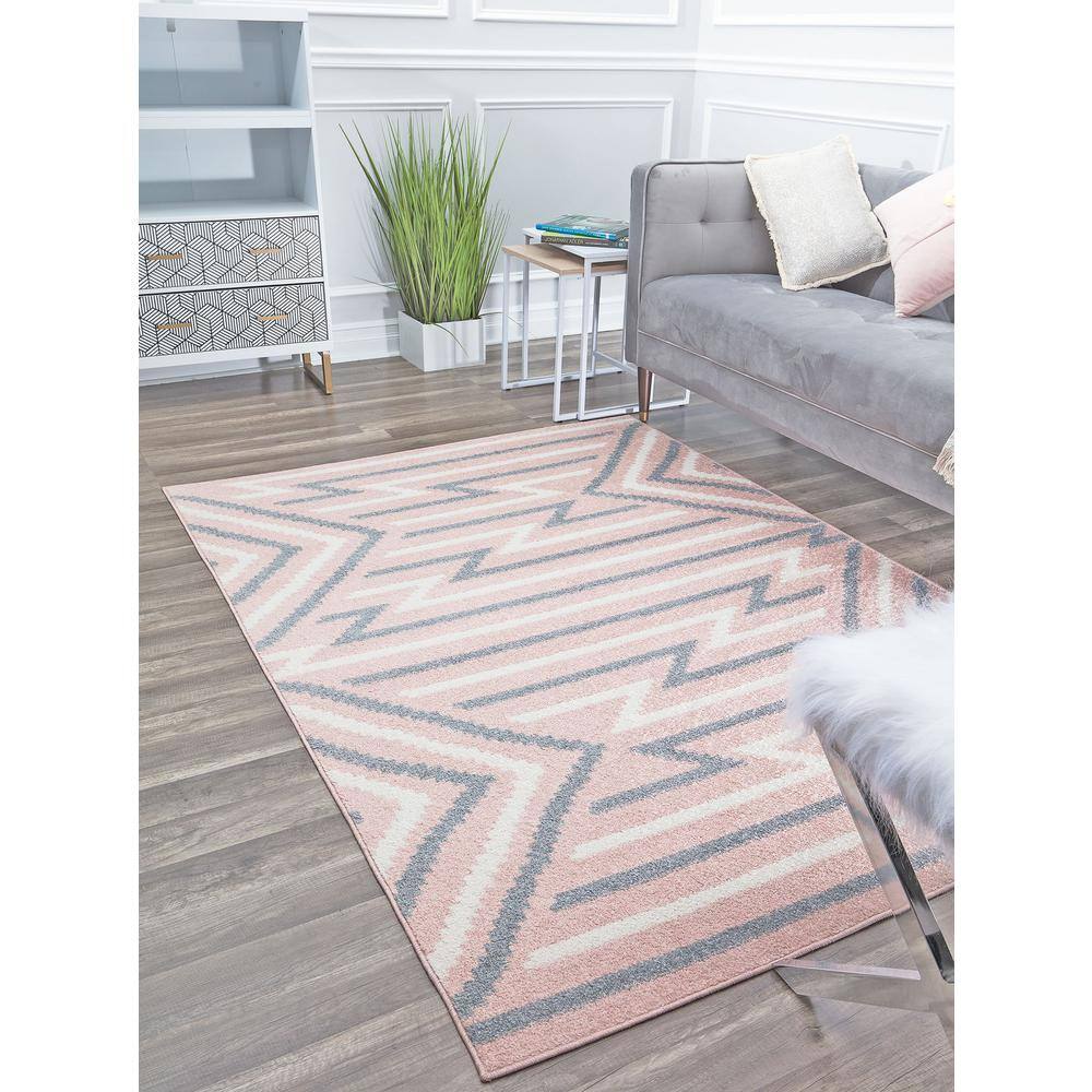 6' x 9' Gray and Pink Geometric Synthetic Area Rug
