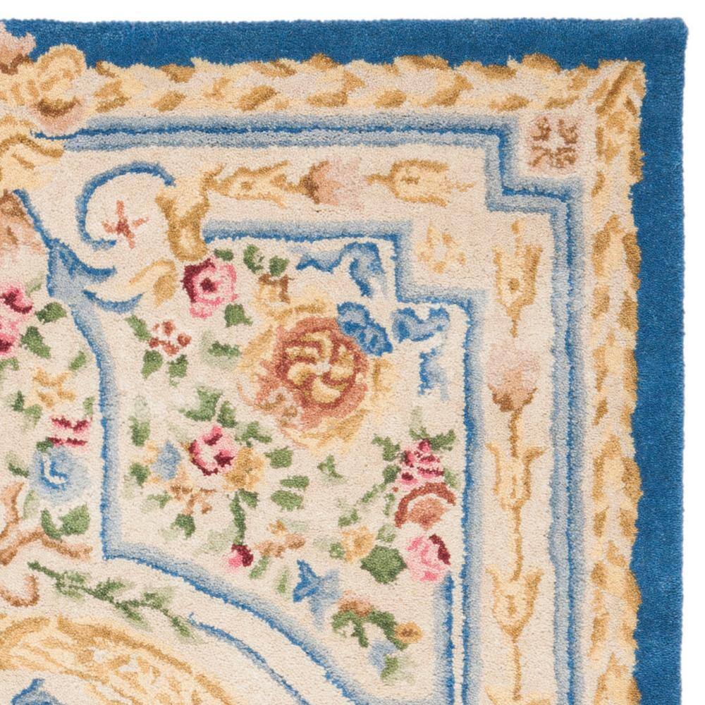 Handmade Blue and Ivory Wool 4' x 6' Tufted Area Rug