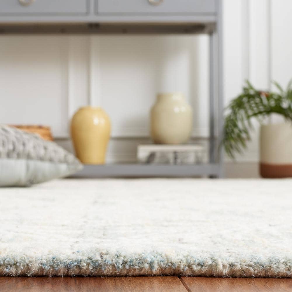 Ivory and Light Blue Tufted Wool 4' x 6' Area Rug