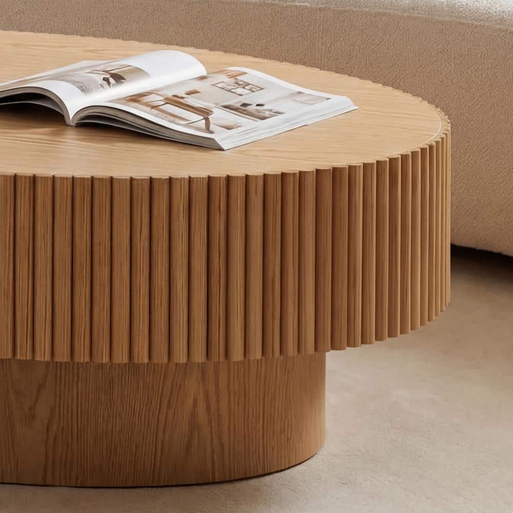 Close-up of the fluted side and smooth top of a natural wood coffee table.