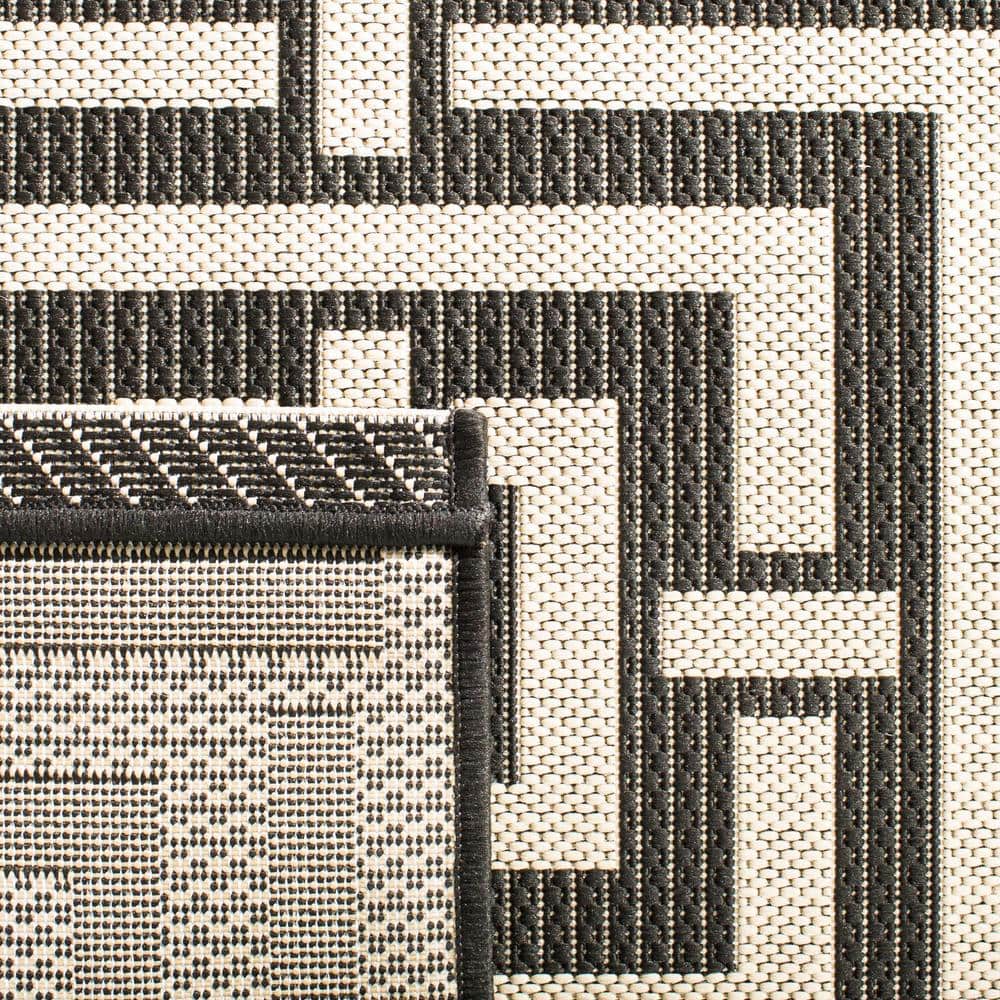 Black and Bone Geometric Indoor/Outdoor Area Rug, 2'7" x 5'