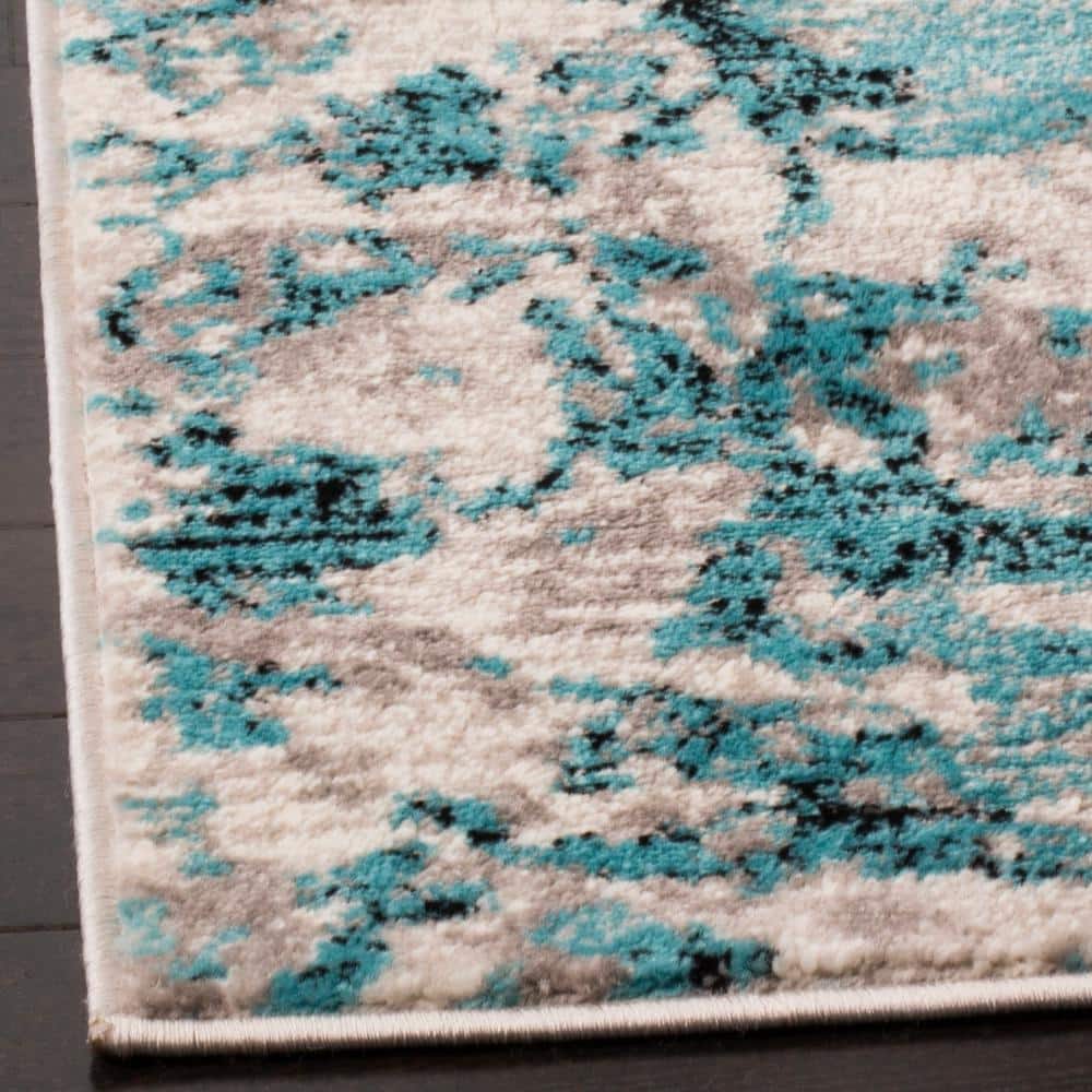 Vibrant Blue and Ivory Abstract Synthetic 6' x 9' Area Rug