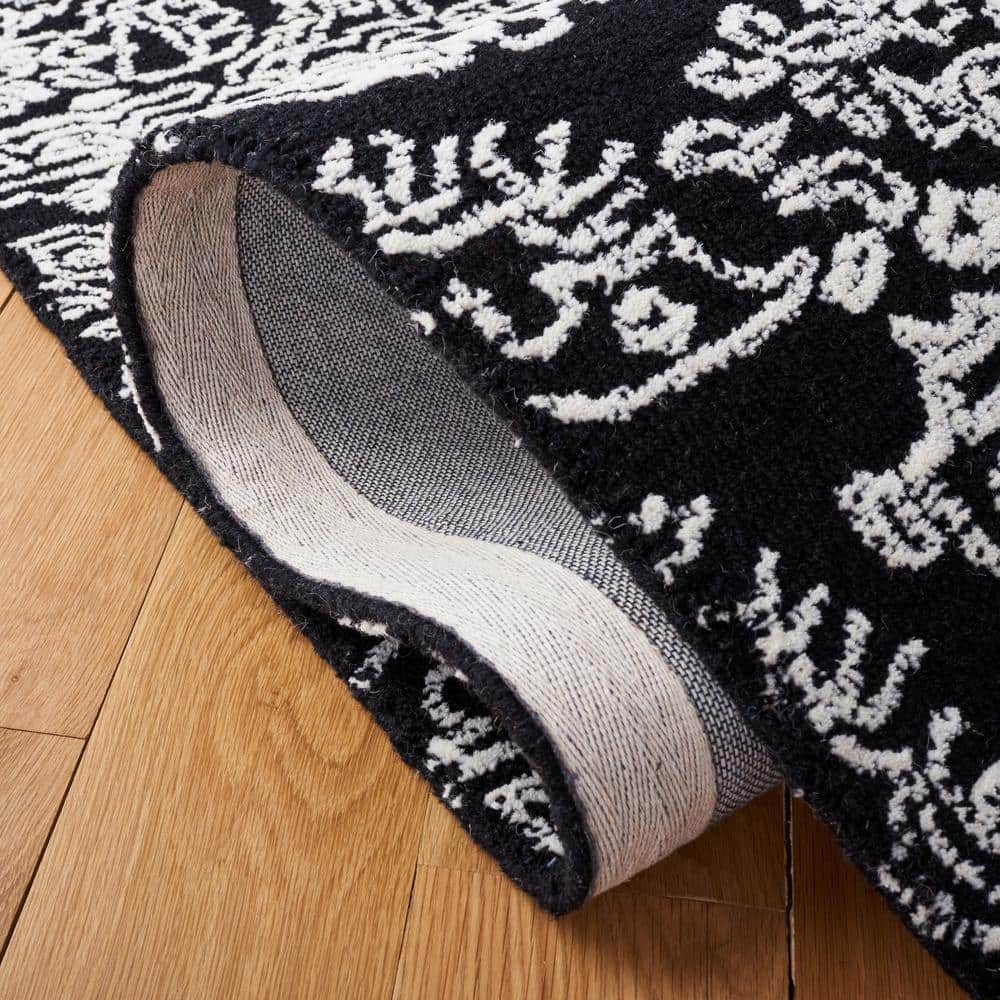 Black and Ivory Floral Hand-Tufted Wool 6' x 9' Area Rug