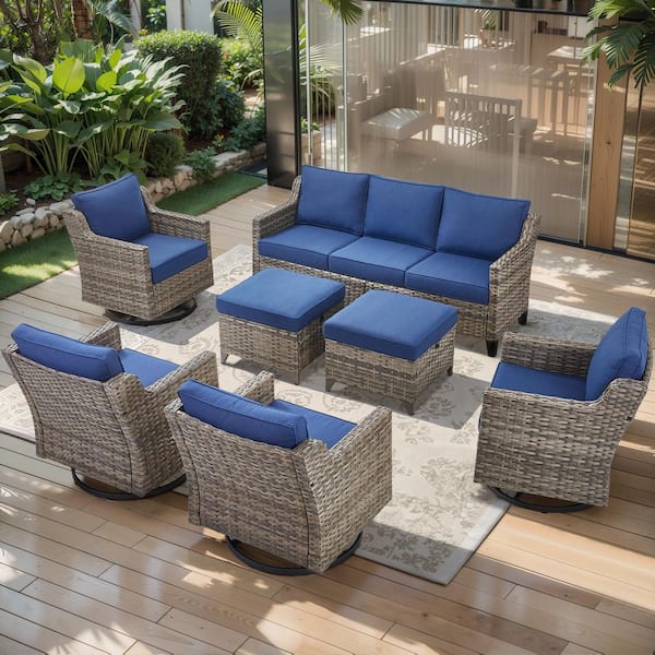 Glissia 7-Piece Gray Wicker Patio Conversation Set with Swivel Gliders and 4 in. Olefin Navy Blue Cushions