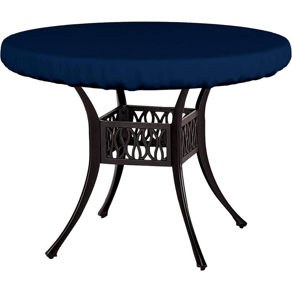 Blue circular outdoor table top cover on a black metal table.