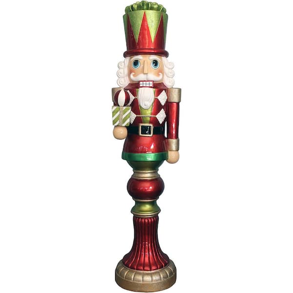 Fraser Hill Farm 4 ft. Christmas Candy-Look Nutcracker Greeter Holding Gift in Red