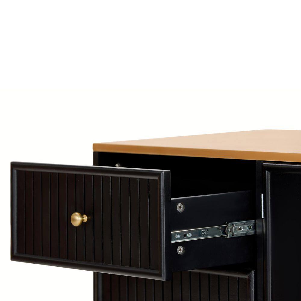 Detail of a drawer front with a gold knob on a sideboard.