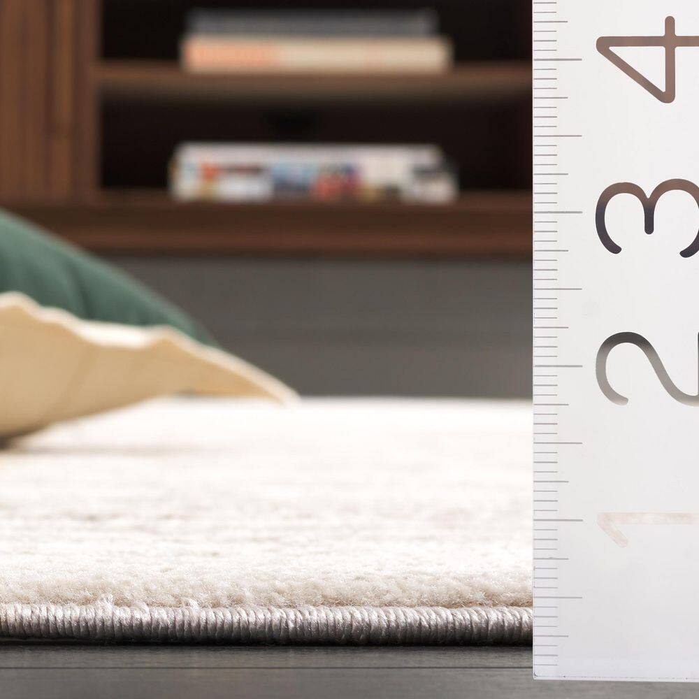 Beige Geometric 8' x 10' Synthetic Easy Care Area Rug