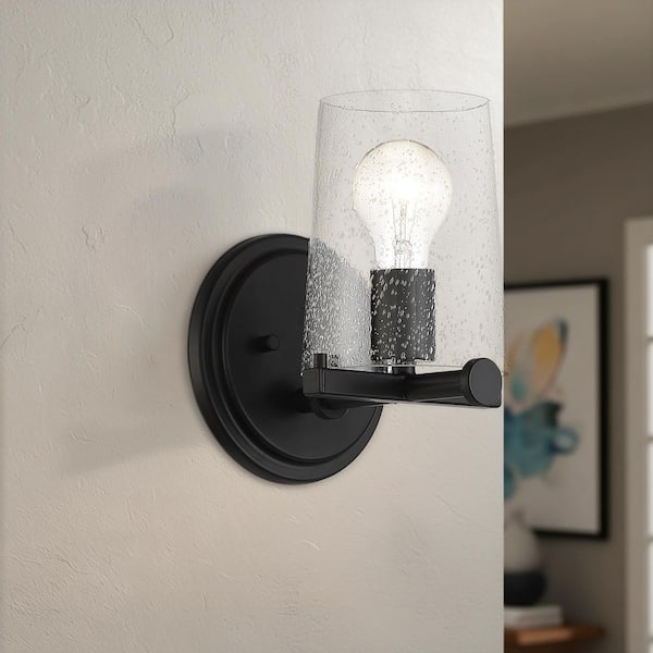Designers Fountain Matteson 6 in. 1-Light Matte Black Industrial Wall Sconce with Clear Seedy Glass Shade