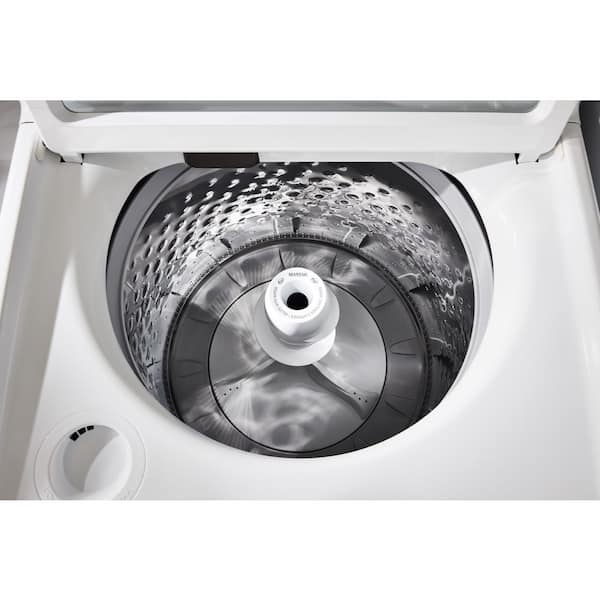 Maytag washing machine drum loaded evenly around agitator with clothes sorted by fabric type