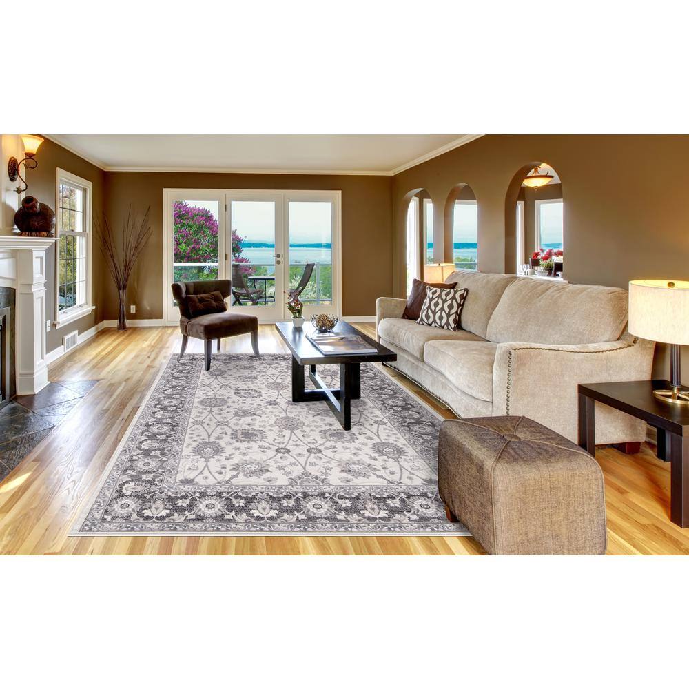 Ivory and Grey Tufted Synthetic 6'7" x 9'3" Stain-Resistant Area Rug