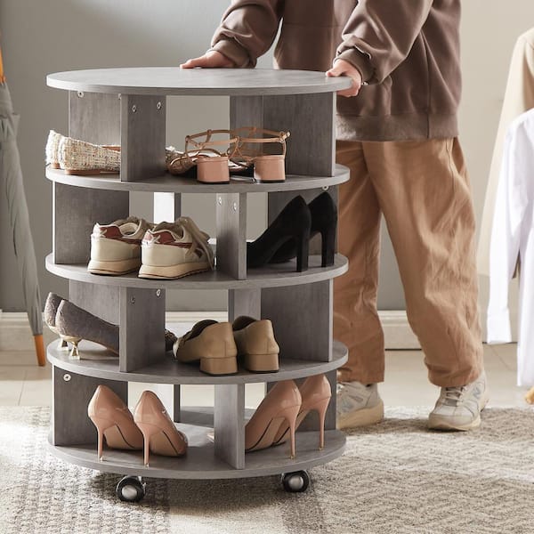 a corner shoe cabinet with shoes and bag shelves that are rotating to give  you evne more stora…