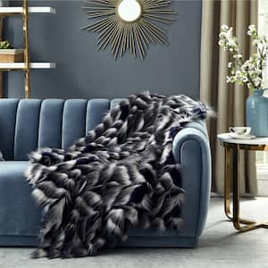 Caron 50 in. x 60 in. Navy Throw Reverse Micromink Front: 80% Acrylic 20% Polyester Back: 100% Polyester