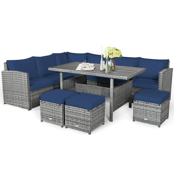 7-Piece Wicker Outdoor Sectional Set with Navy Cushions and Dining Table