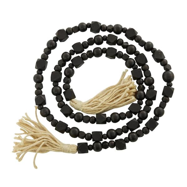 Litton Lane Black Handmade Mango Wood Hexagon Carved Geometric Long Beaded Garland with Tassel