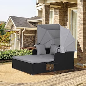 Black Wicker Outdoor Day Bed with Retractable Canopy and Gray Cushions