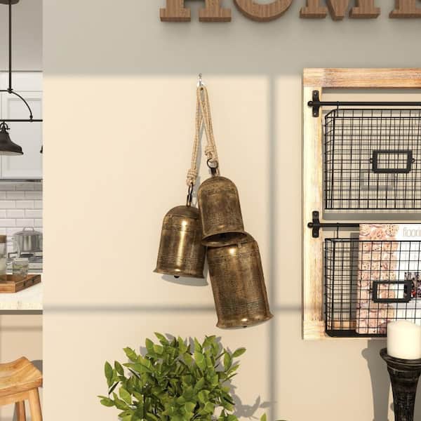 Litton Lane 5 in. x 10 in. Gold Metal Tibetan Inspired Cylindrical