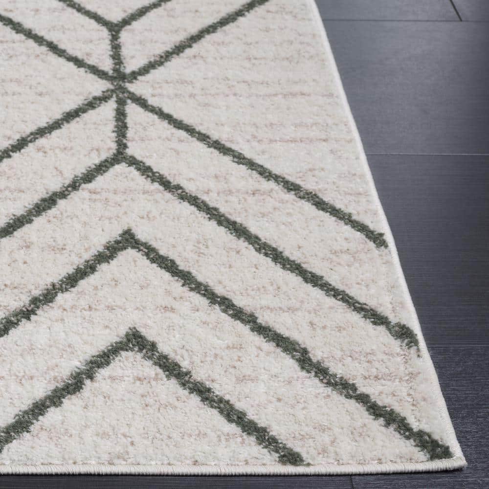 Ivory and Dark Green Geometric Synthetic Area Rug