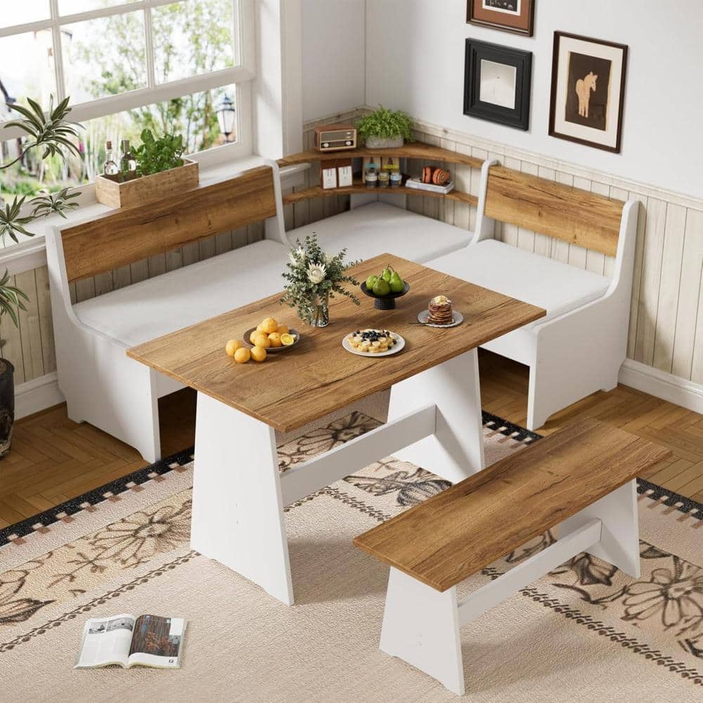 White and wood L-shaped breakfast nook set on a patterned rug.