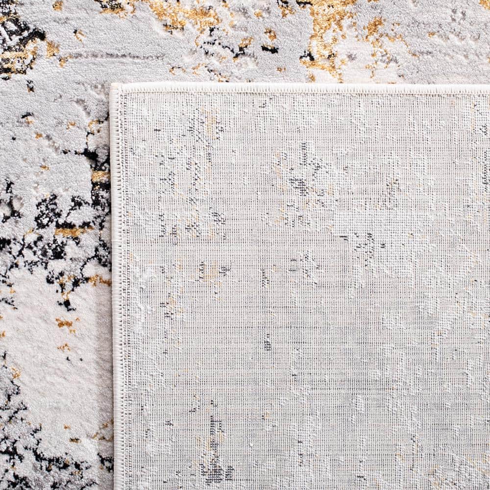 Cream and Gold Abstract 4' x 6' Stain-Resistant Area Rug