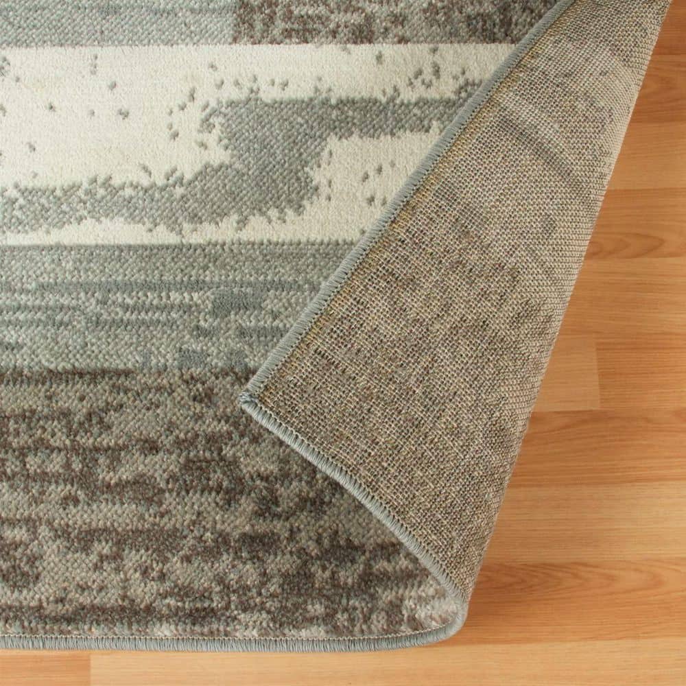 Ivory Geometric Synthetic 5' x 8' Easy-Care Area Rug