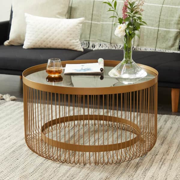 Litton Lane 32 in. Gold Round Metal Coffee Table with Tinted Glass Top