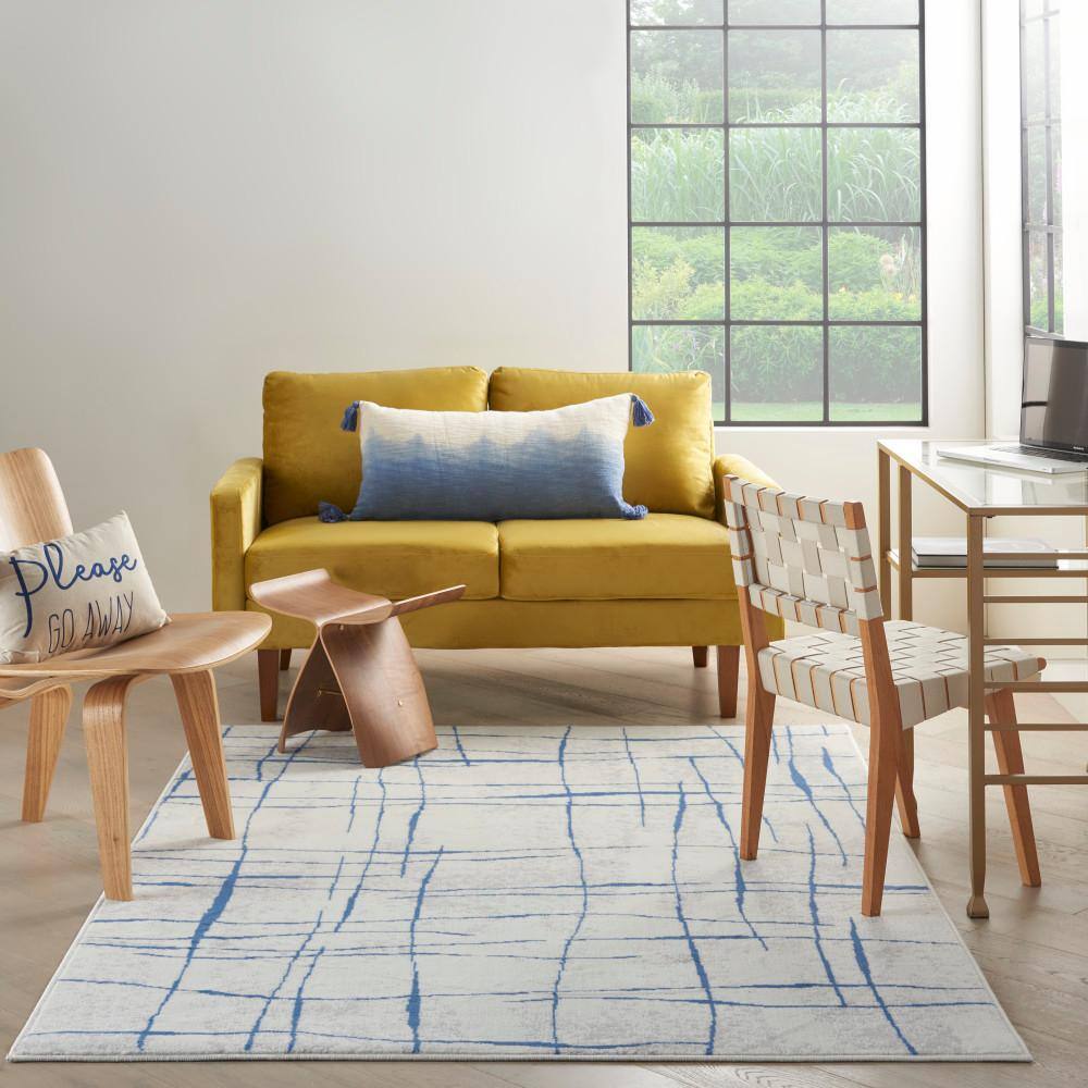 Ivory Abstract Linear 6' x 9' Machine-Made Synthetic Area Rug