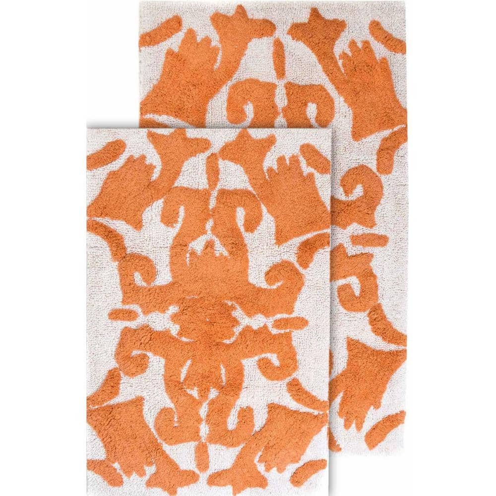 https://images.thdstatic.com/productImages/4da8746a-d15f-4871-93e8-c150ebcc671d/svn/white-and-coral-chesapeake-merchandising-bathroom-rugs-bath-mats-37314-64_1000.jpg