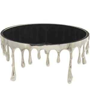 36 in. Silver Medium Round Aluminum Drip Coffee Table with Melting Designed Legs and Shaded Glass Top