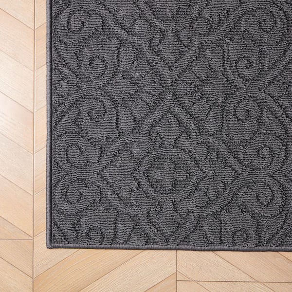 Feya Solid Dark Gray 2 ft. x 5 ft. Tufted Medallion Polypropylene Runner Rug