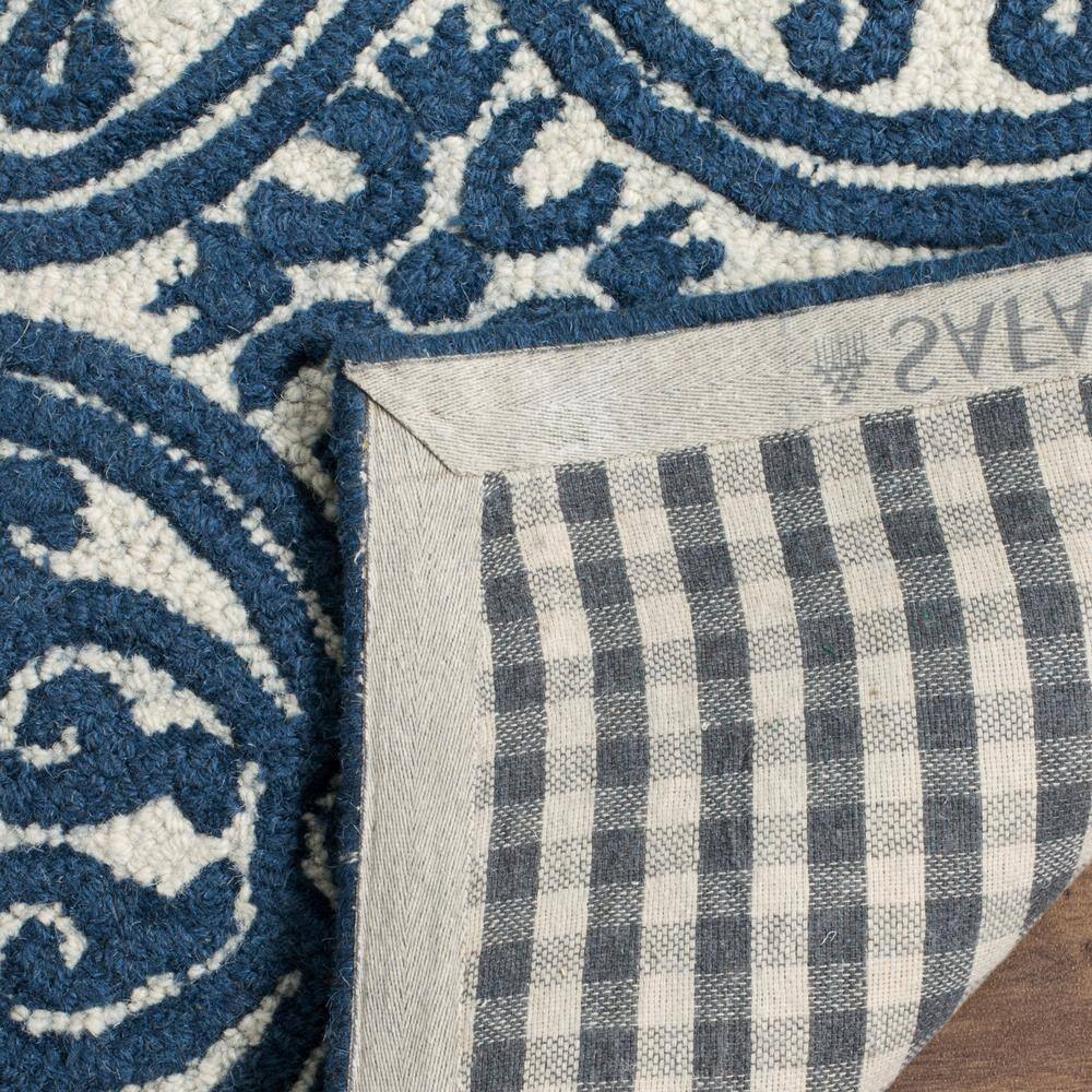 Ivory and Navy Geometric Wool 6' x 9' Handmade Tufted Rug