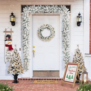 2-Pack 9 ft. Pre-lit LED Artificial Christmas Garland and 24 in. D Pre-lit Snow Flocked Christmas Wreath Set