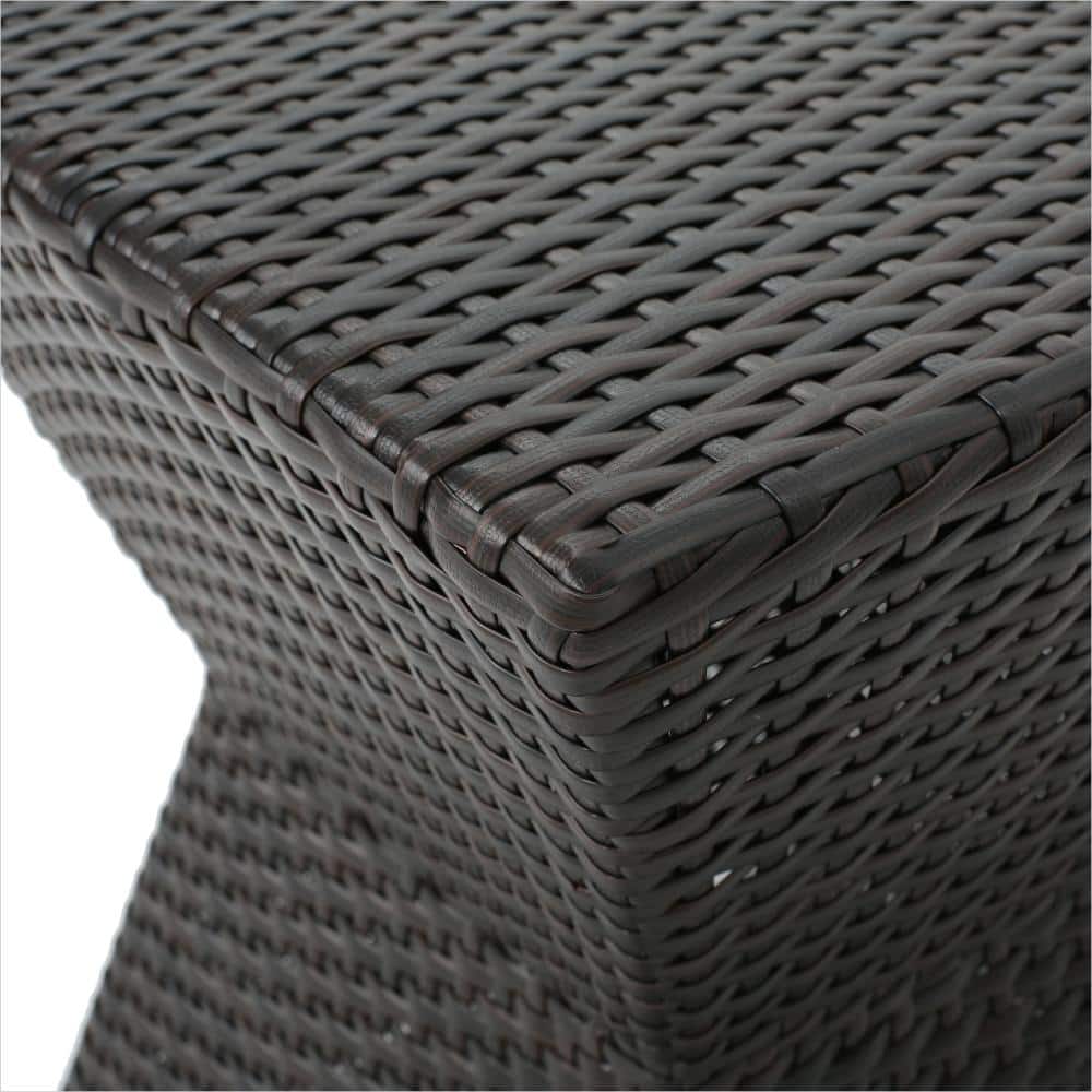 Close-up of the woven texture of the wicker end table.