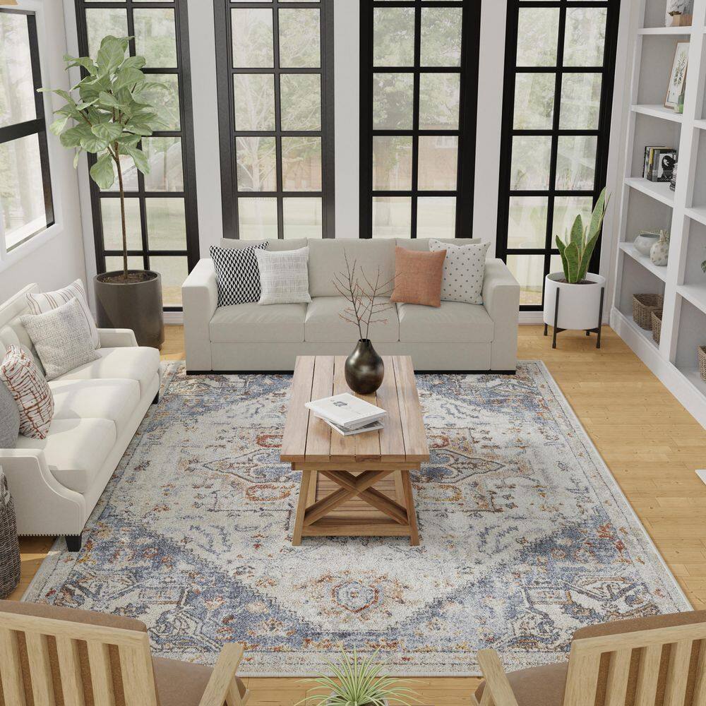 Cream and Blue 6' x 9' Synthetic Oriental Area Rug