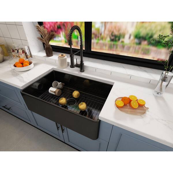 https://images.thdstatic.com/productImages/4e73ba8c-0c33-451d-b461-6c99a5689470/svn/black-tobili-farmhouse-kitchen-sinks-w14-331810-b-c3_600.jpg