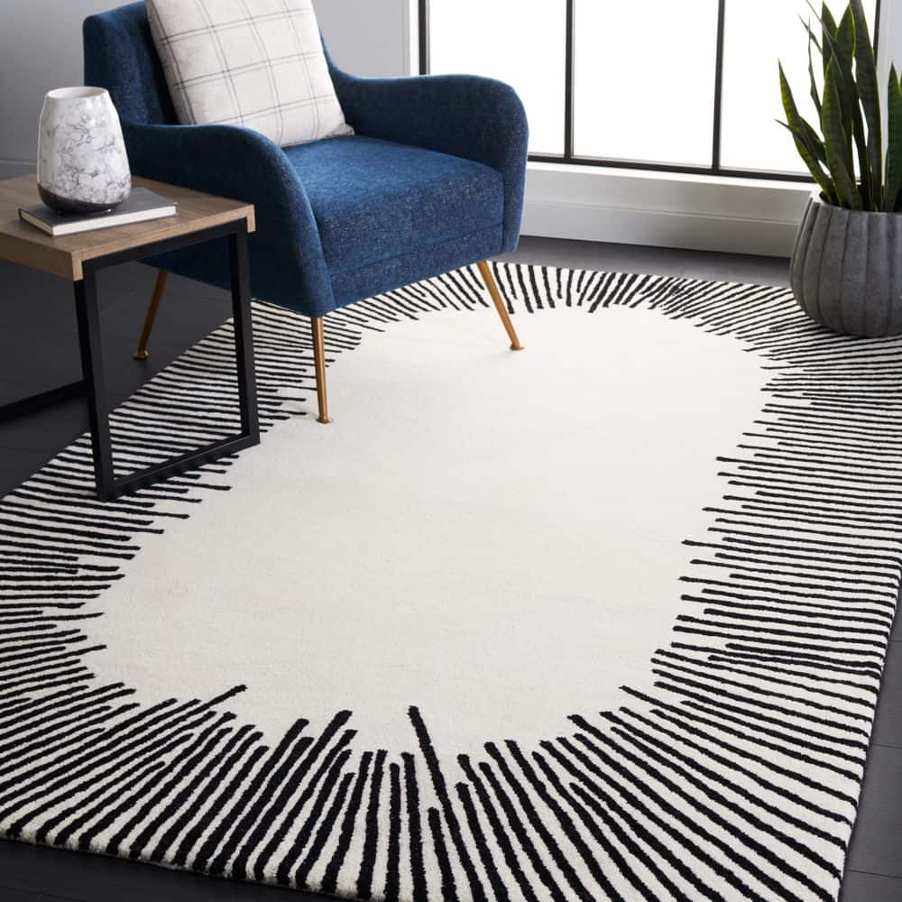 Handmade Tufted Black and Ivory Wool Area Rug 6' x 9'