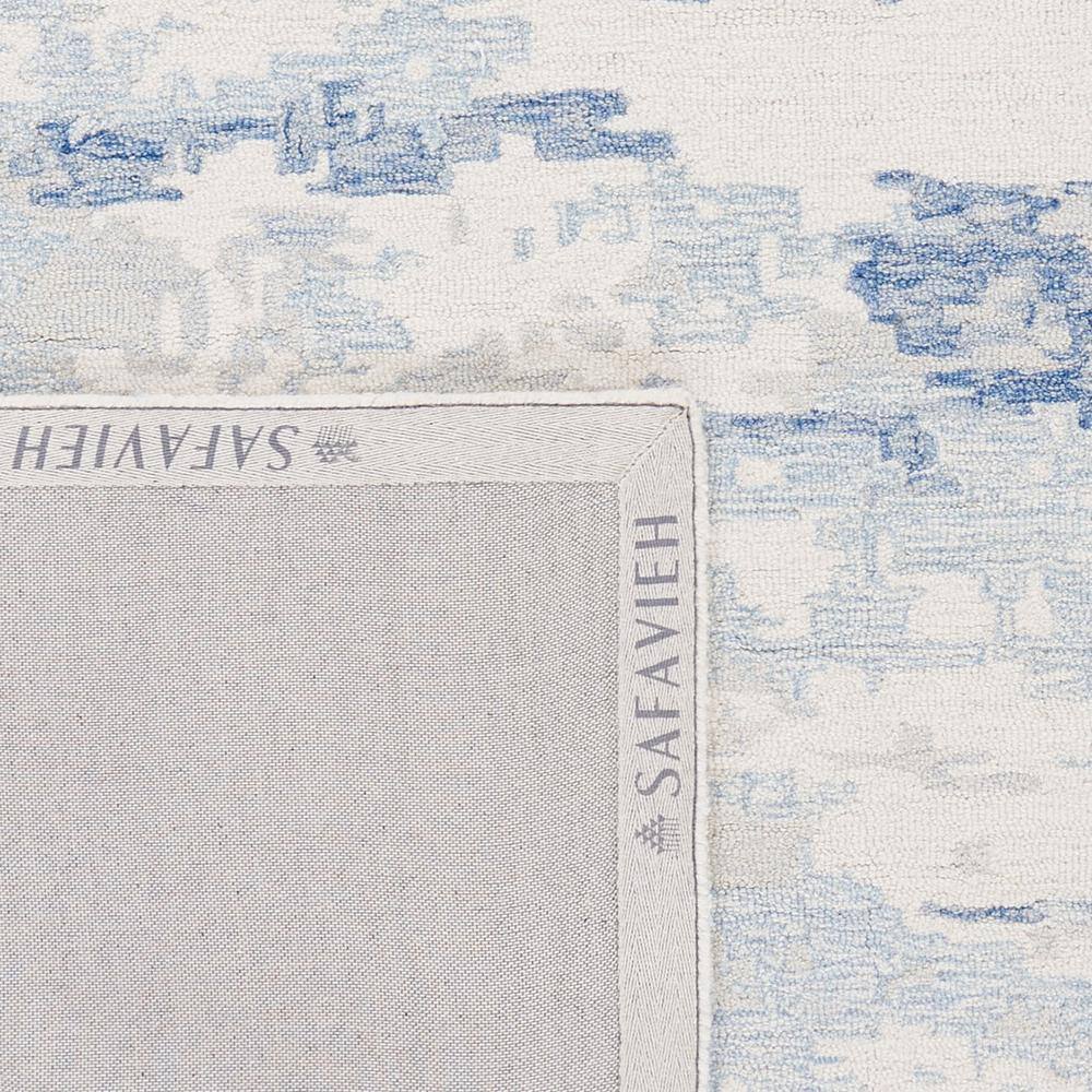 Ivory and Blue Handmade Wool Abstract Area Rug