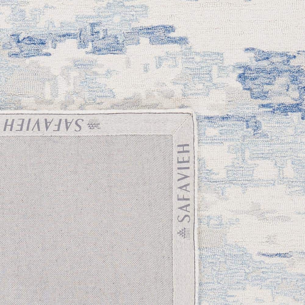 Ivory and Blue Abstract Hand-Tufted Wool 8' x 10' Rug