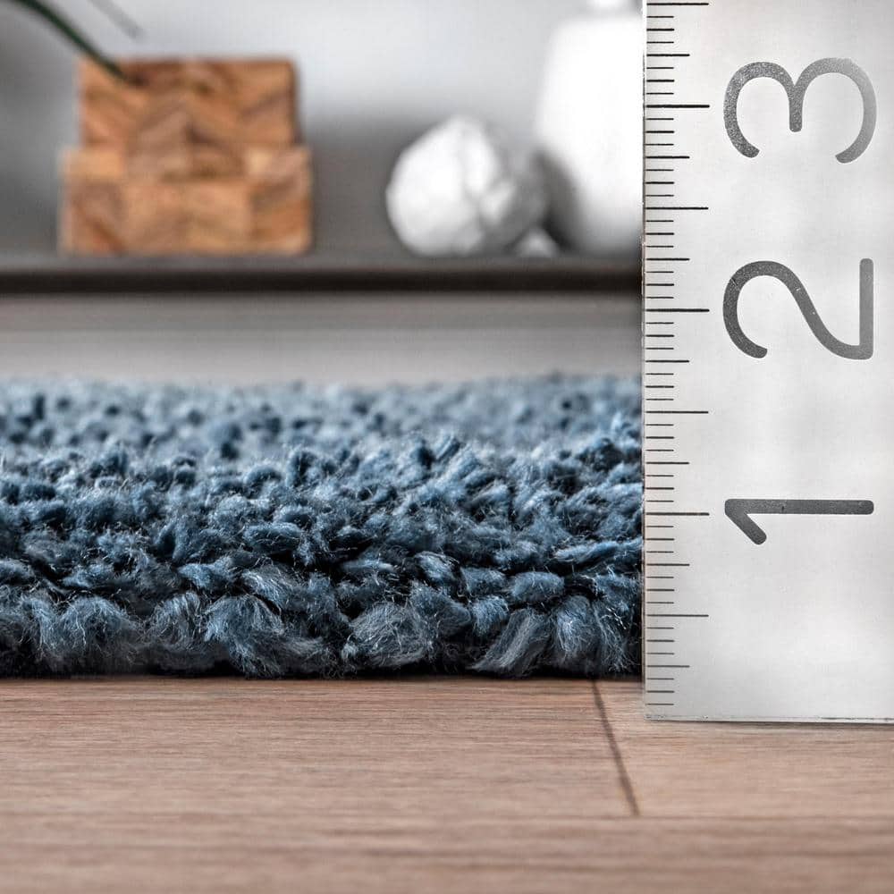 Neva Blue Synthetic Tasseled Shag 7x9 Area Rug