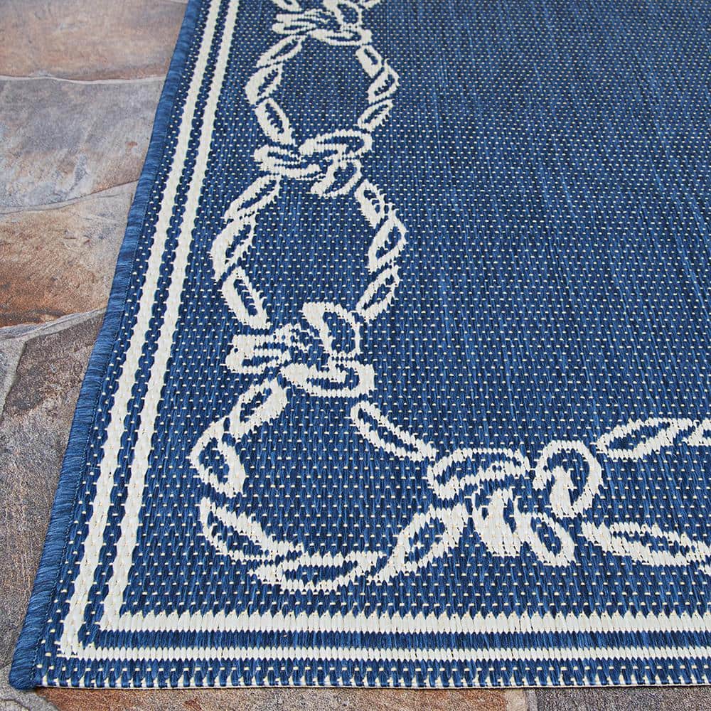 Ivory and Indigo Round Synthetic Indoor/Outdoor Area Rug