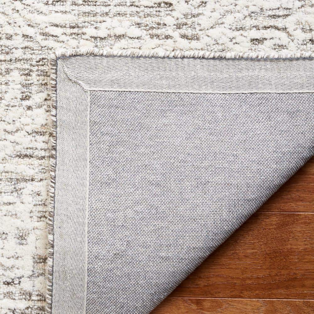 Ivory and Gray Tufted Wool 8' x 10' Area Rug