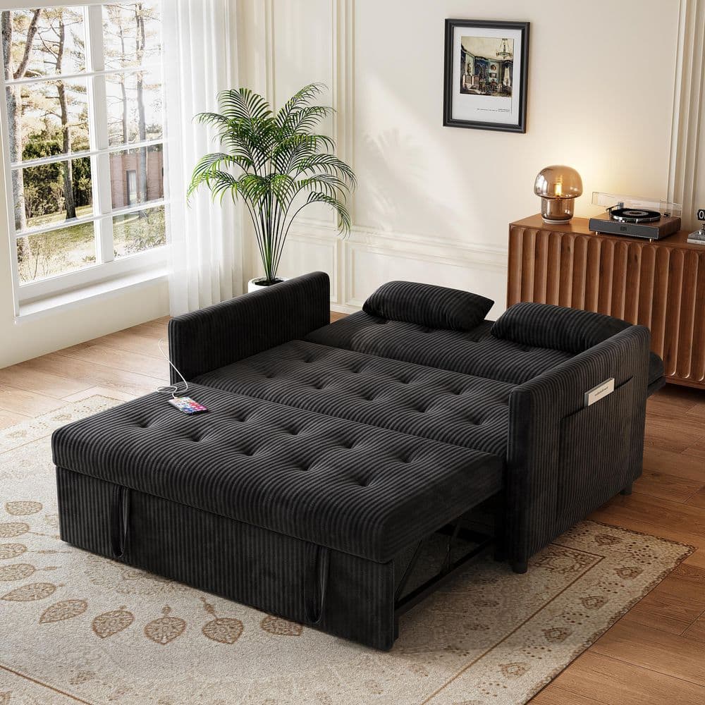 Black corduroy convertible sleeper sofa in an extended position.