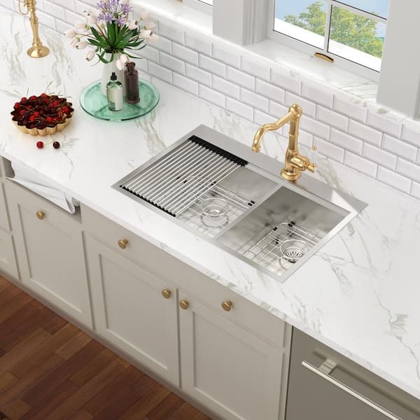 https://images.thdstatic.com/productImages/4ed9a571-ec09-4303-99c3-d2528d11456d/svn/silver-drop-in-kitchen-sinks-asstqb3322a264-c3_600.jpg