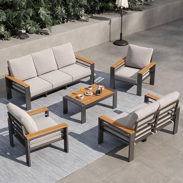 Stylish 5-Piece Black Aluminum Patio Seating Set with Comfortable Light Gray Cushions and a Matching Table