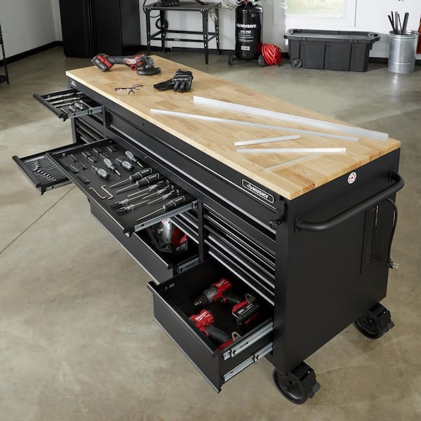 https://images.thdstatic.com/productImages/4ef11535-bf4b-4ce2-95ca-3d703eeac917/svn/matte-black-with-black-trim-husky-mobile-workbenches-holc7218bb1mys-66_600.jpg