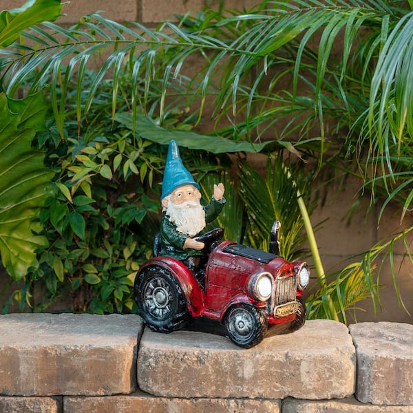 10 in. Tall Outdoor Garden Gnome Riding Red Tractor Yard Statue Decoration with LED Lights, Multicolor