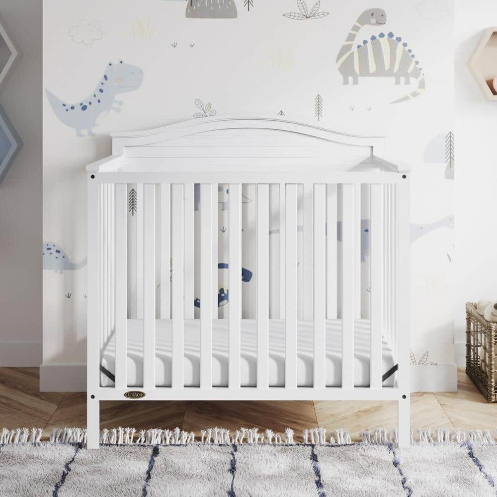 Stella White Pine Wood 4-in-1 Convertible Mini Crib with Foam Mattress