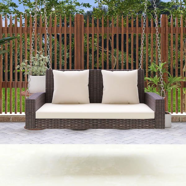 Unbranded 2-Person Outdoor Brown Wicker Patio Swing with Beige Cushions and Pillow